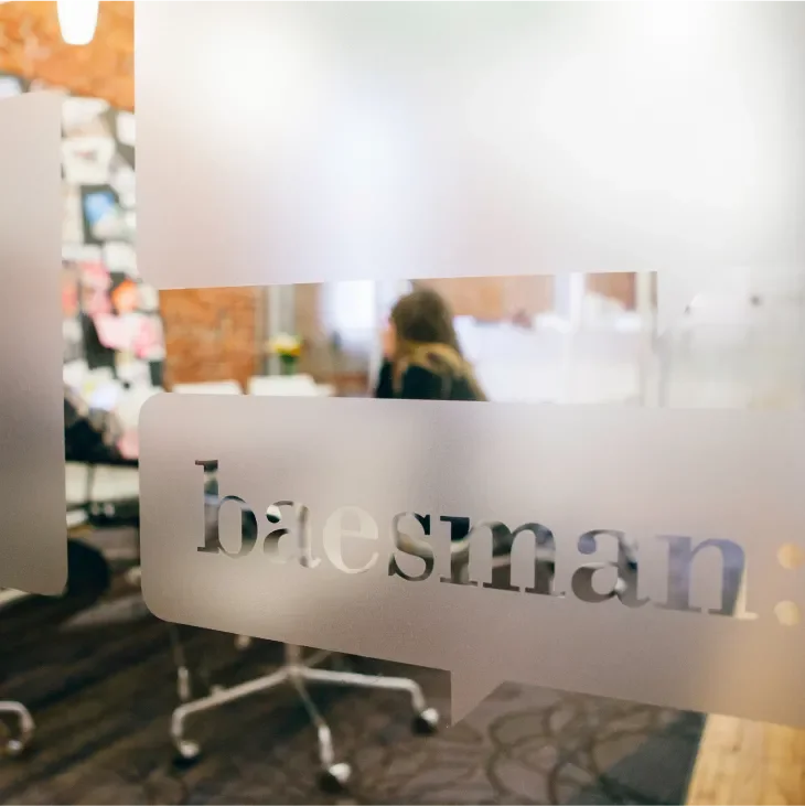 Image showing one of the private offices with a logo of Baesman on the office window 