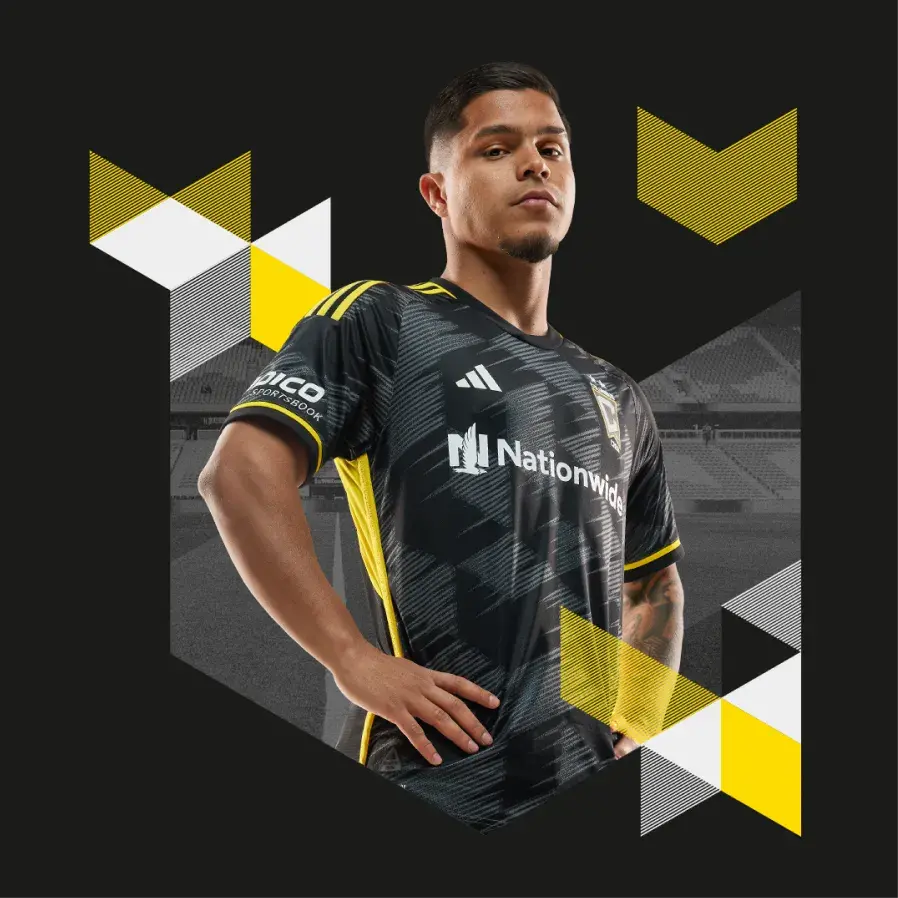 Player standing confidently amid new branding elements