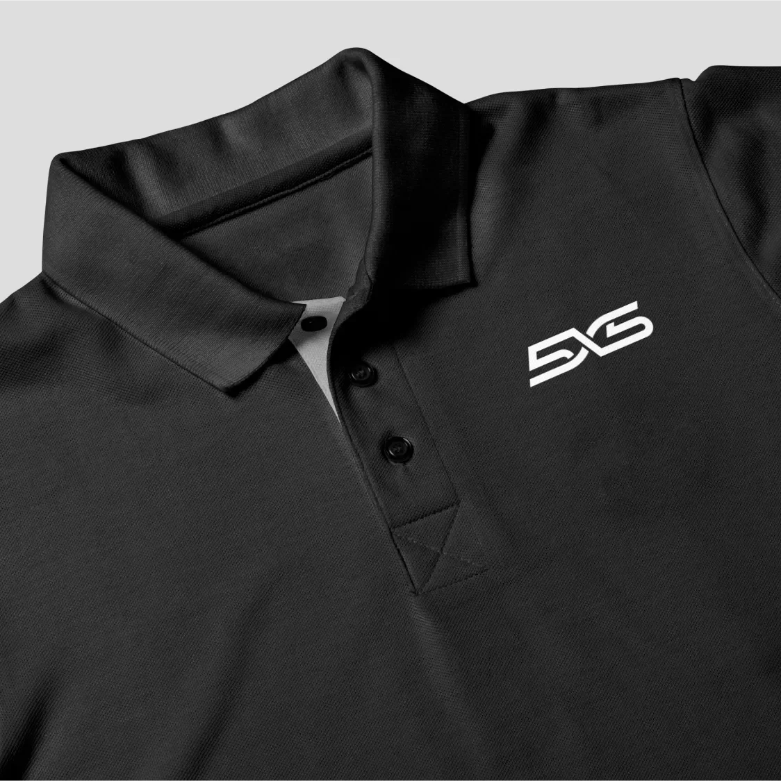 5x5 logo mocked up on a black polo