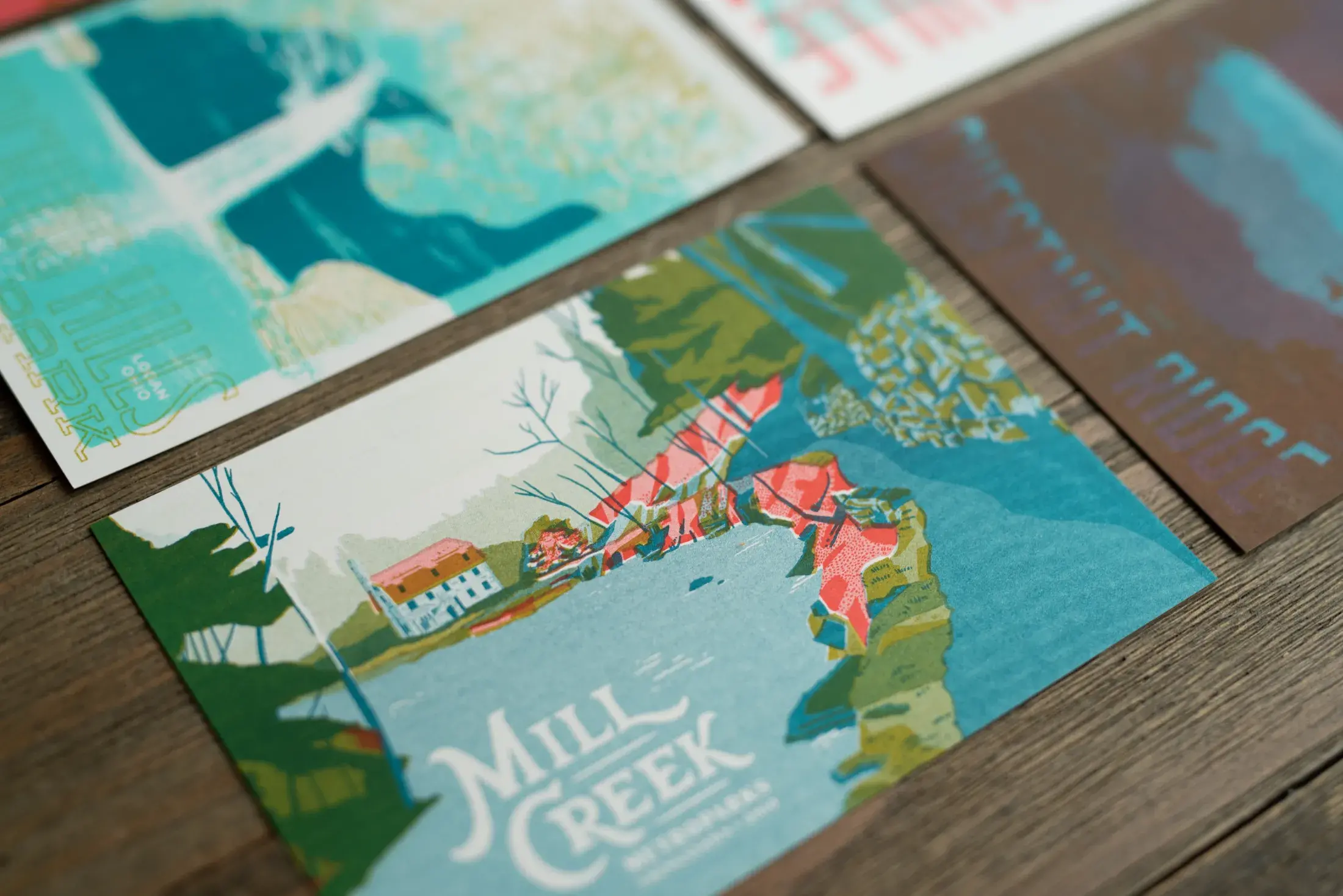 Closeup of the Mill Creek Park postcard with other cards surrounding
