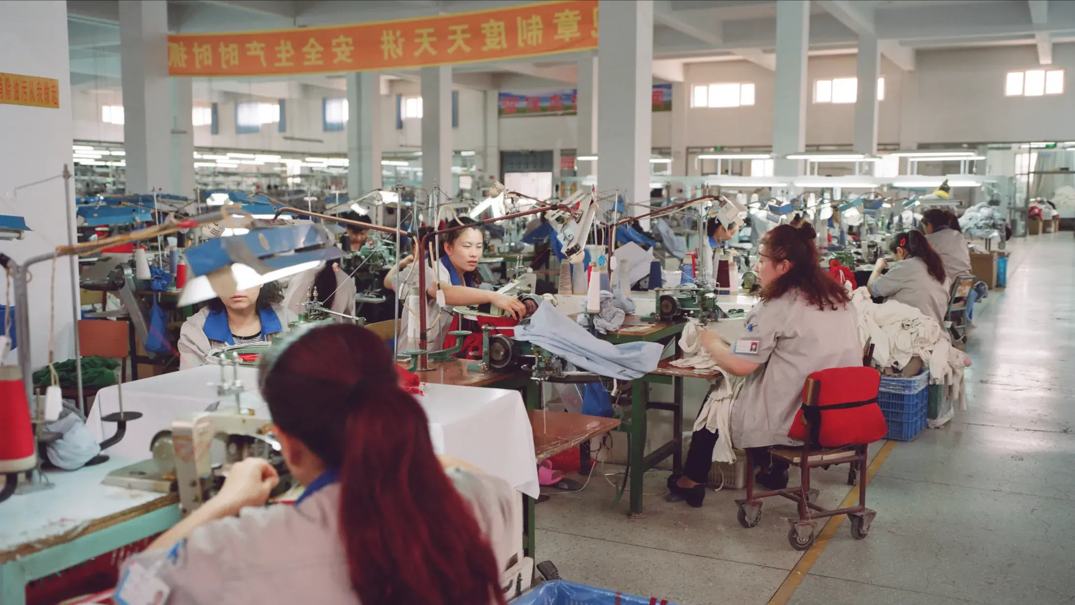 factory full of workers sewing at their stations