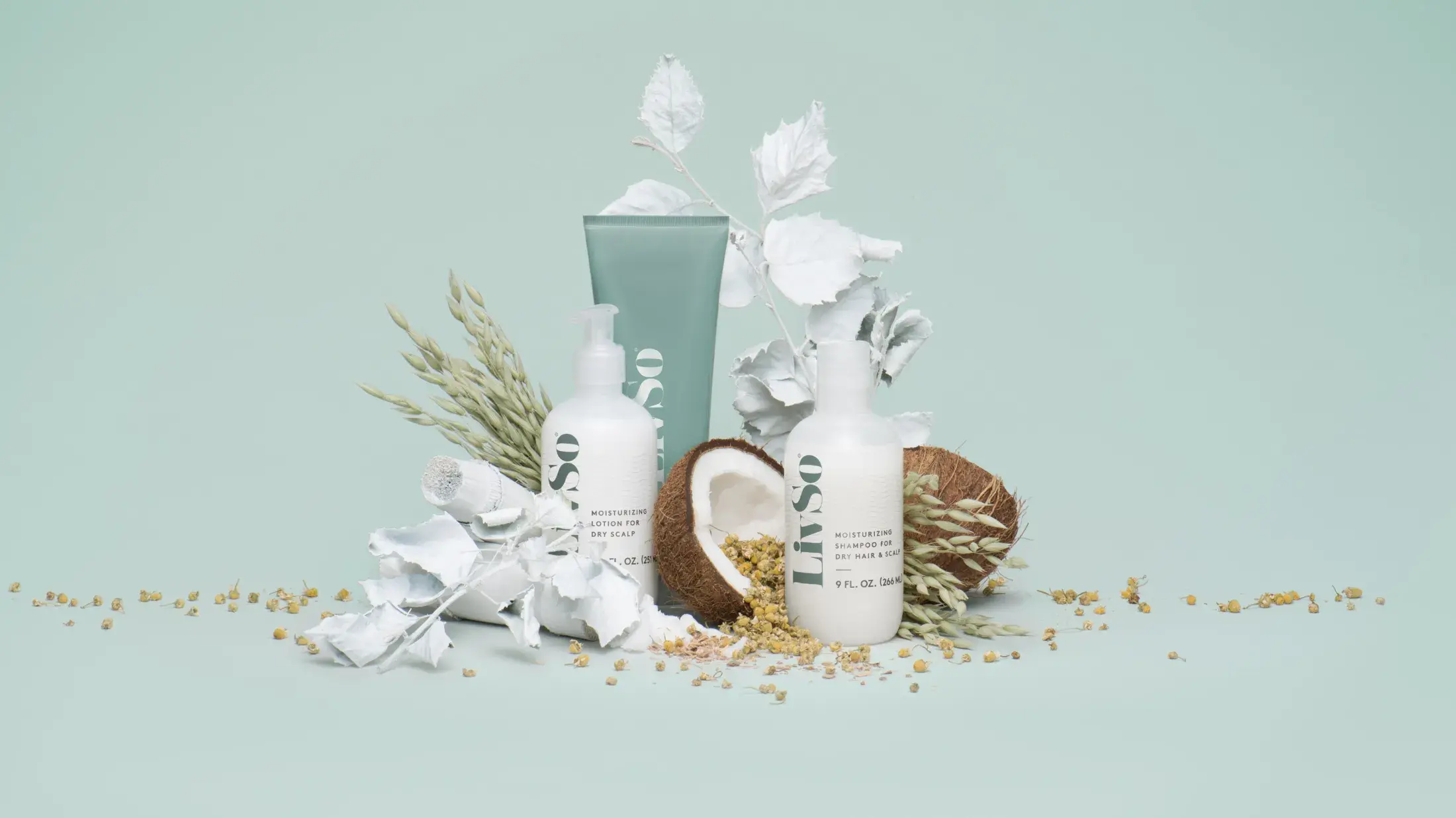 LivSo hair products staged with ingredients on a light sage/mint color