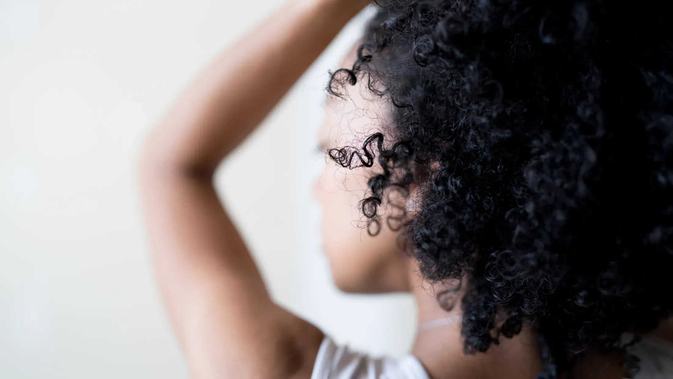 Side view of a woman's curly hair