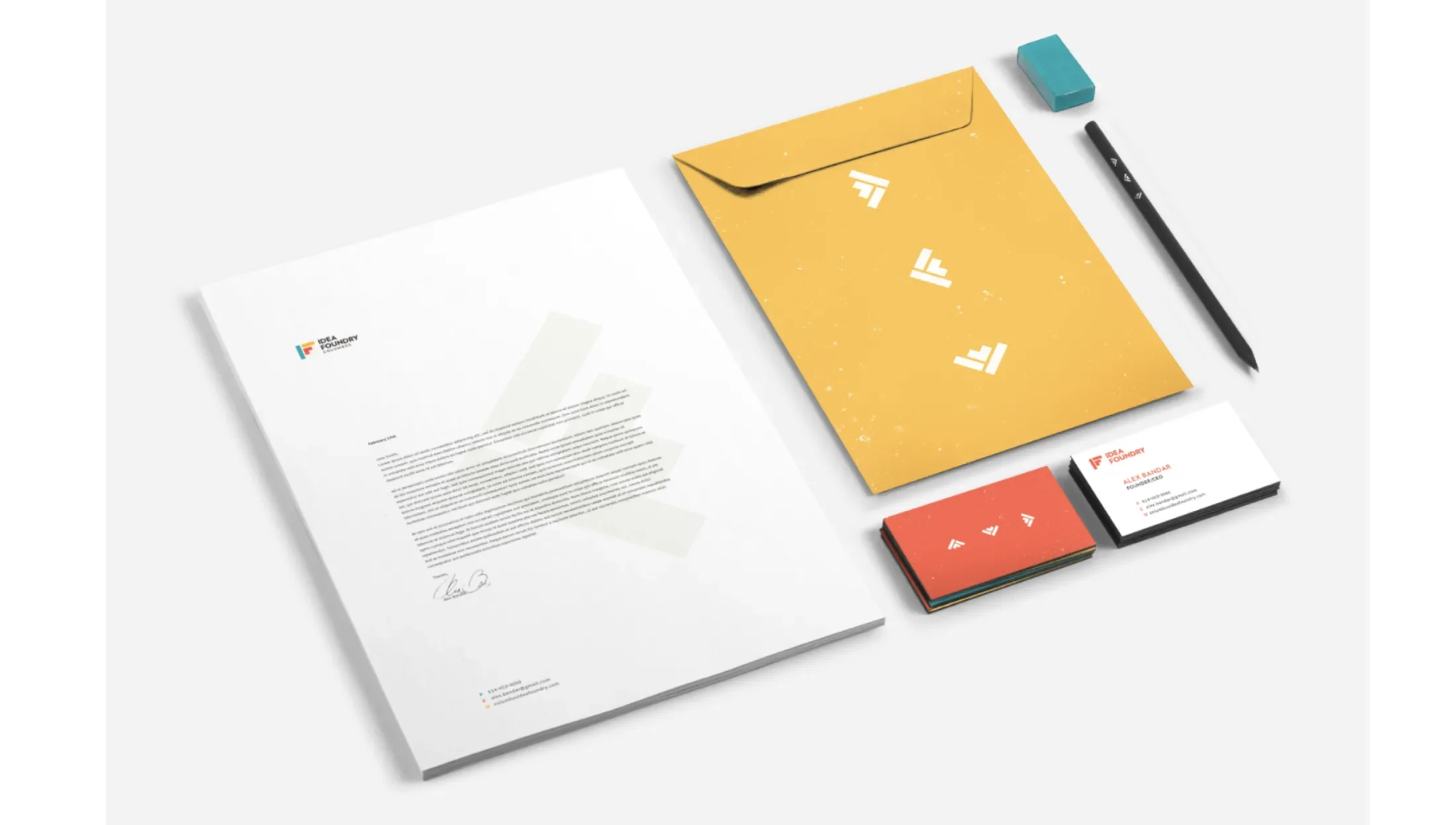 A branded pencil, envelope, letterhead and business cards 