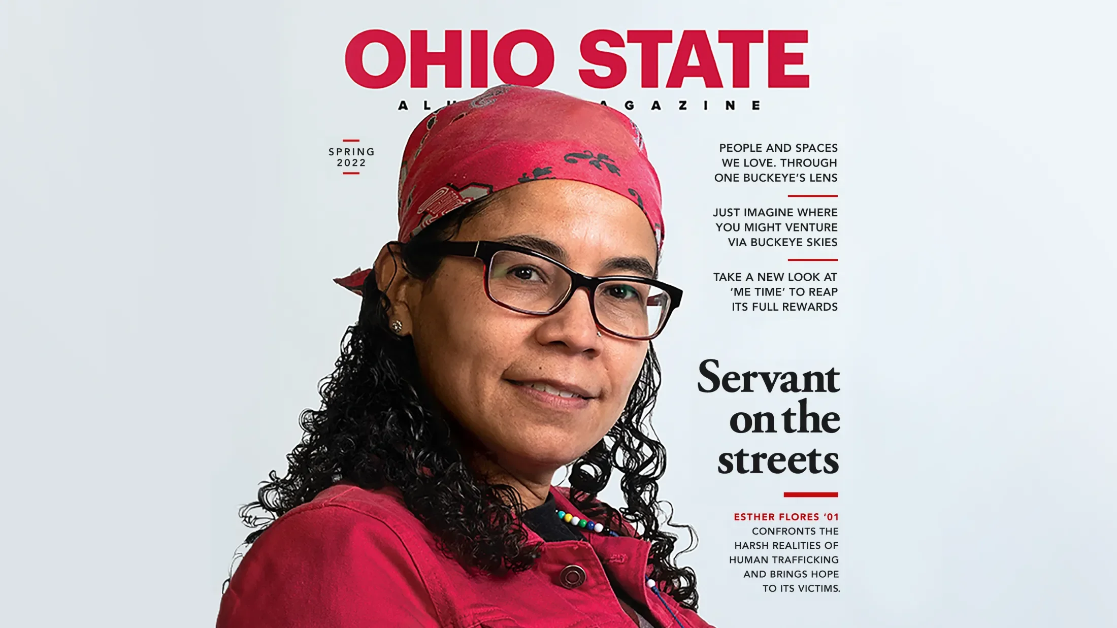 Cover of an ohio state alumni magazine showing a woman in a red button up shirt and red hat on backwards