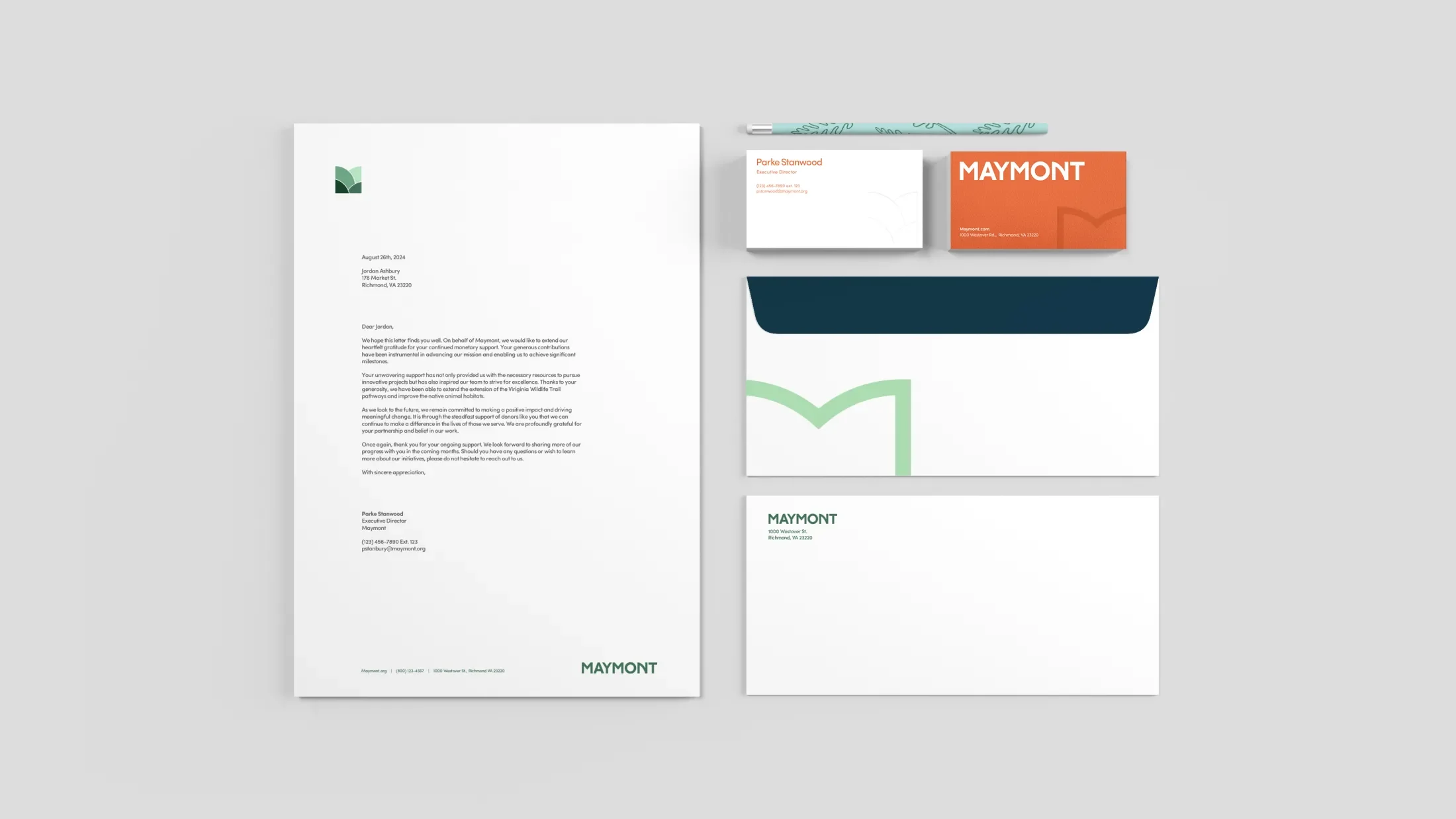 various branded business materials including business cards envelopes and letterhead