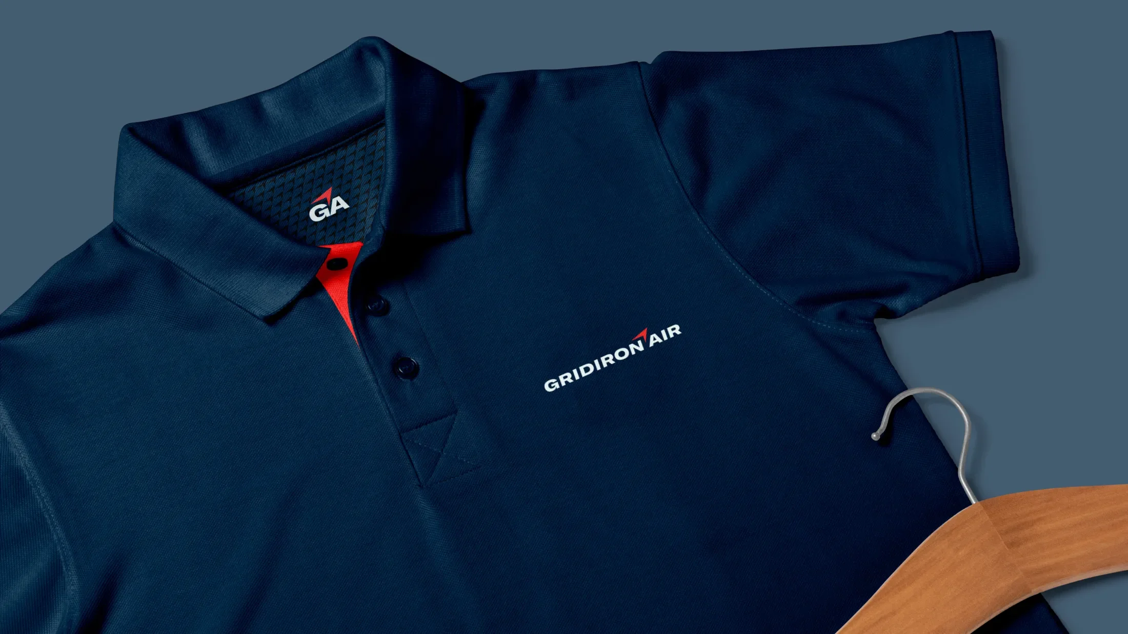 navy polo mocked up with gridiron air branding