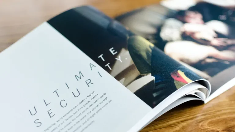 Open book with a page that reads "Ultimate Security"