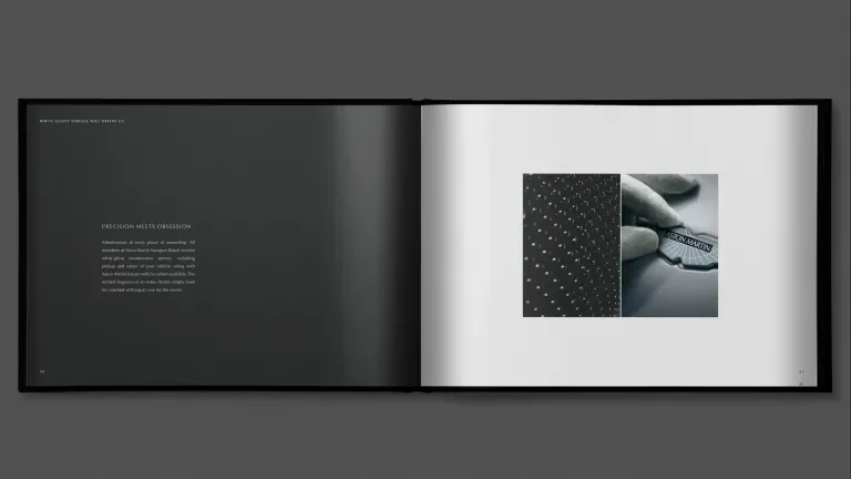 an open book with a black page with text on the left and a white page with two black and white images on the right