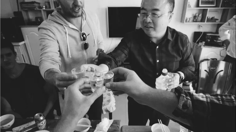 four people share a shot