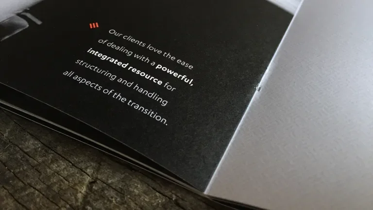 corner of booklet page reads, "Our clients love the ease of dealing with a powerful integrated resource for structuring and handling all aspects of the transition"