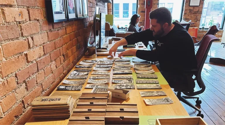 Brent Presley assembling bento boxes with all the pieces laid out on the table