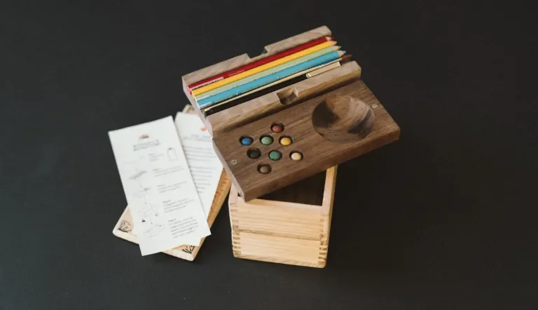 Open bento box, emphasis on the pencil and paint trays