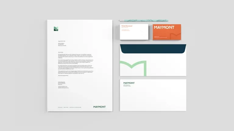 various branded business materials including business cards envelopes and letterhead