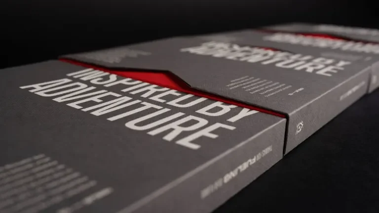 Unboxing experience of the 2024 Holiday Gift, interior packaging sliding out from exterior sleeve