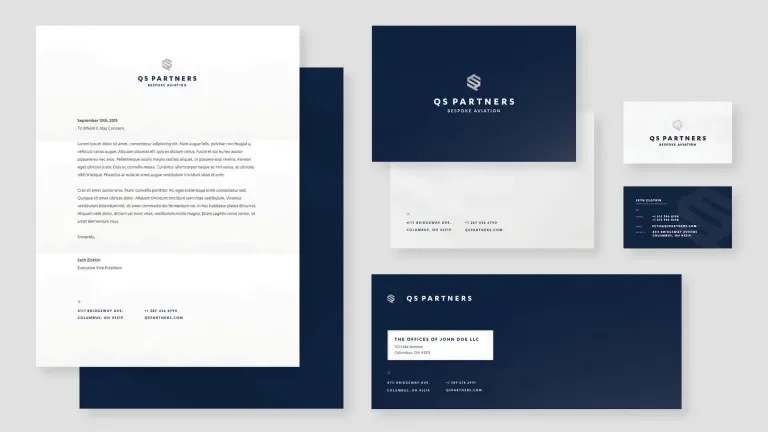 Arrangement of QS Partners branded stationary