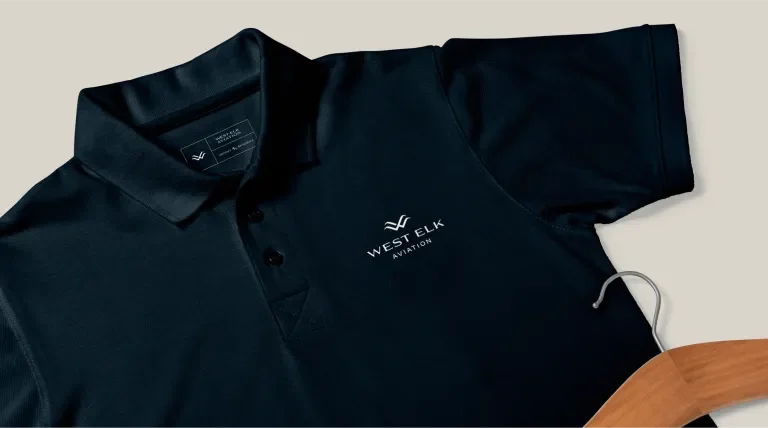 West Elk Aviation logo on a navy polo