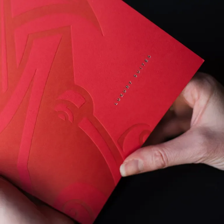 cover of booklet showing detail of debossment and foil letters