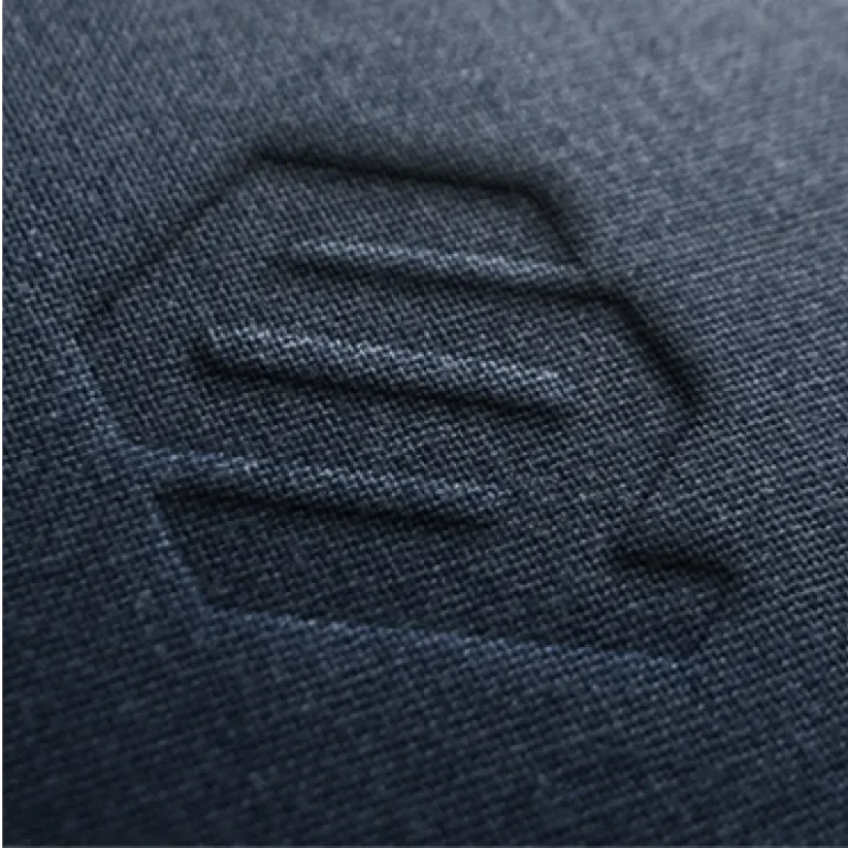 Debossed QS Partners logos