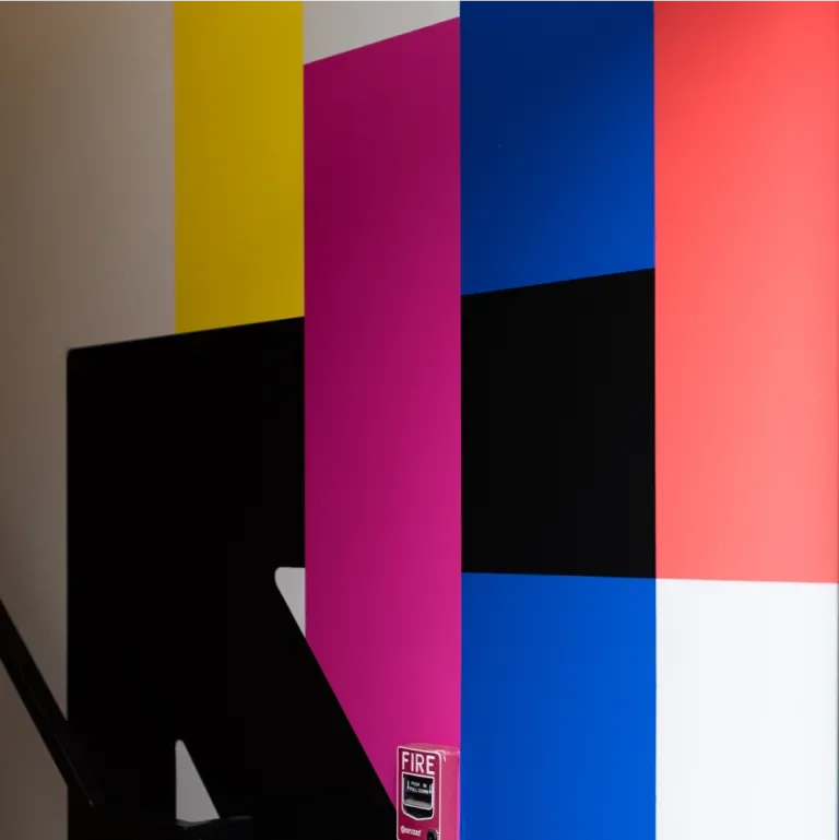 Collage of brand colored square with an arrow pointing up and to the left