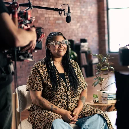 Erin Upchurch smiling while being filmed