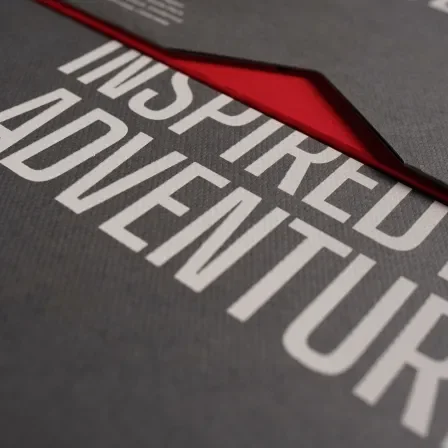 Close-up on packaging, which says "Inspired by Adventure"