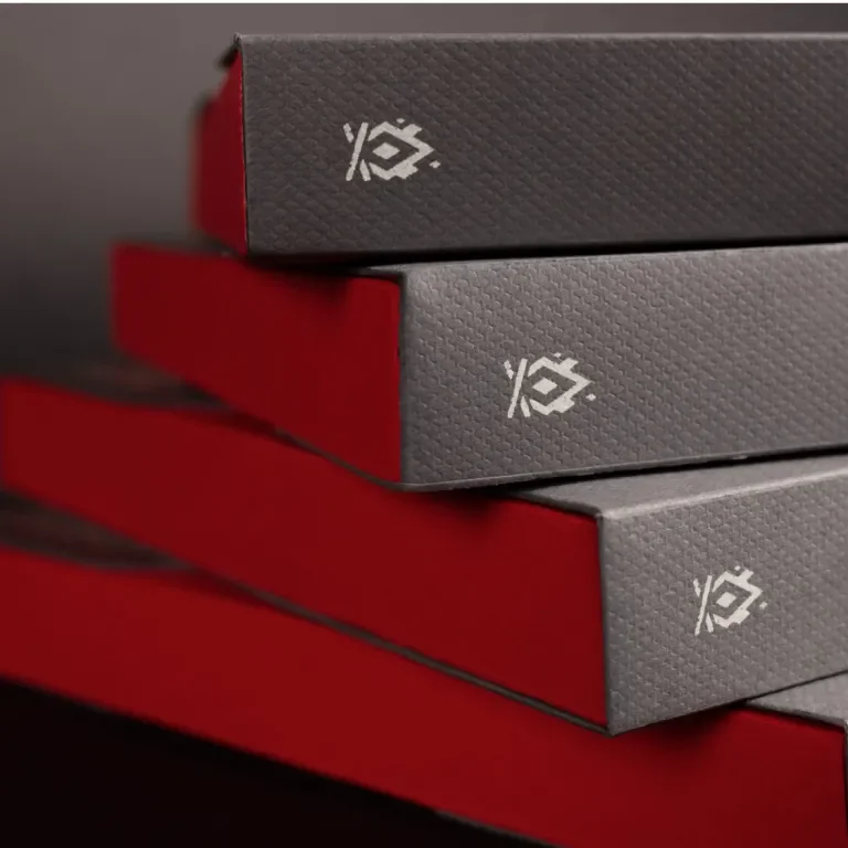 A stack of desk calendar packaging, featuring the Bonfire Red logo on the spine