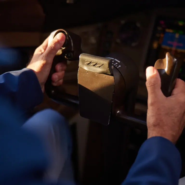 Pilot holding the yoke of a Boeing 777