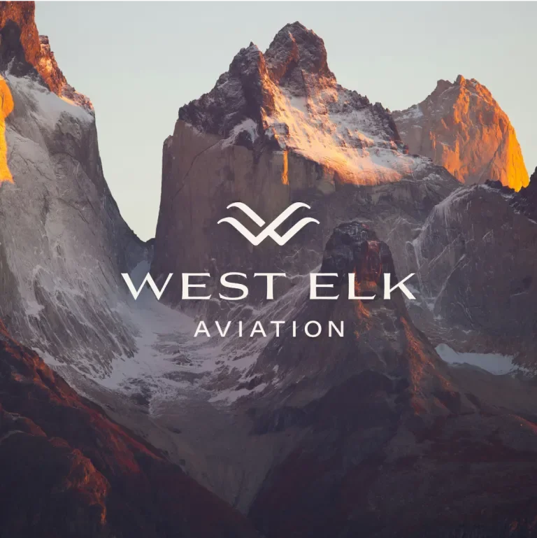 west elk aviation logo against a mountainous backdrop