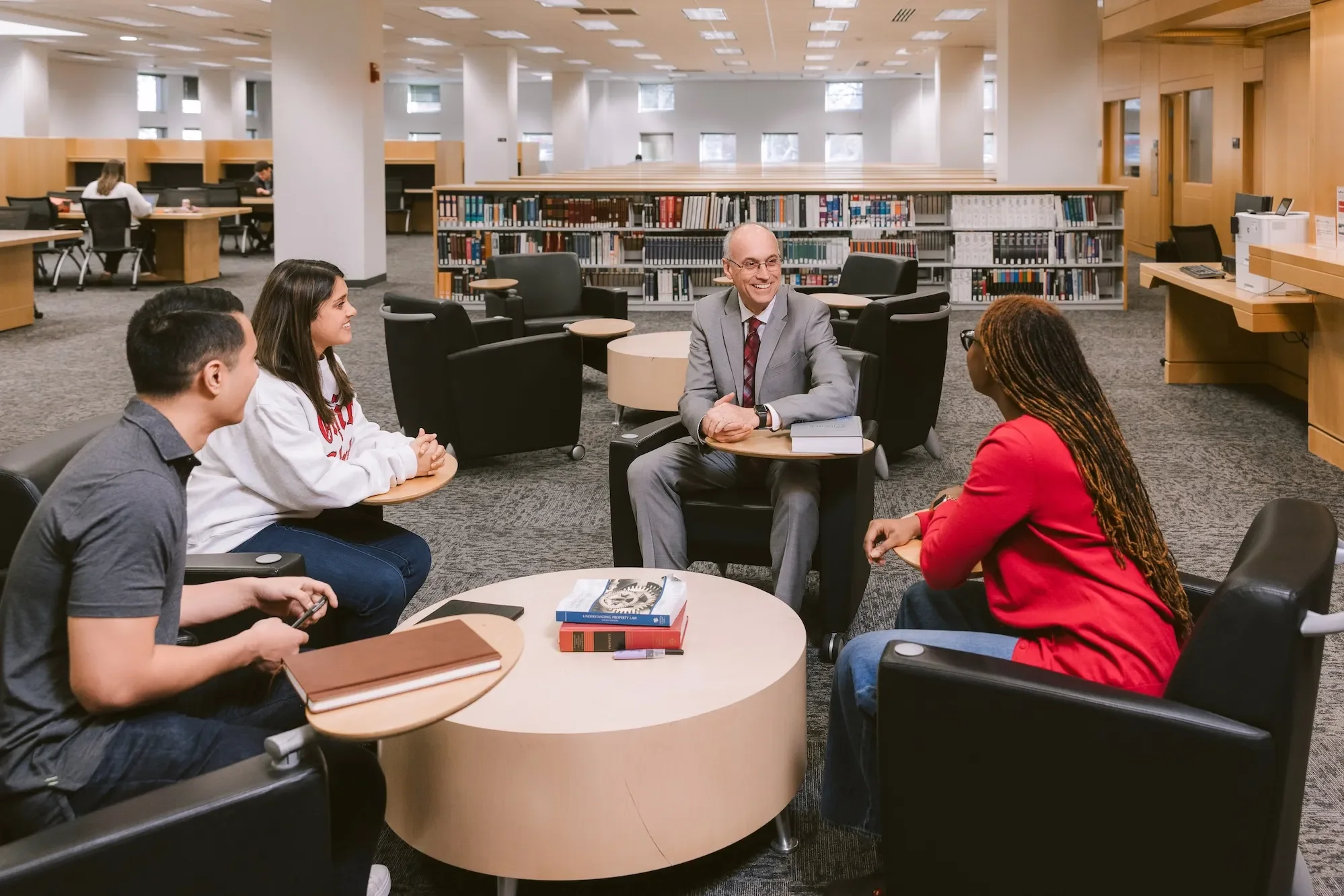 Ohio State Moritz College Professor with students in a library