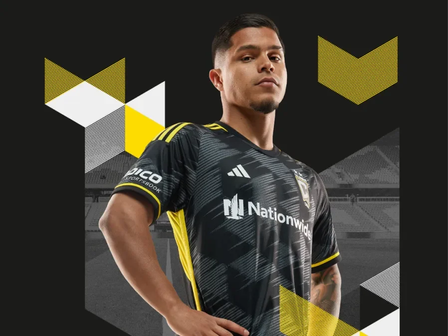 Player standing confidently amid new branding elements