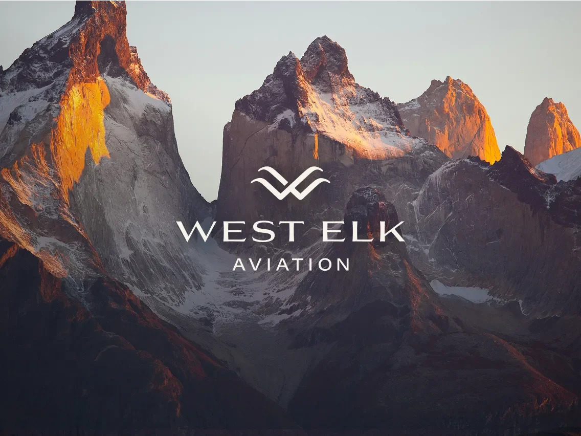 west elk aviation logo against a mountainous backdrop